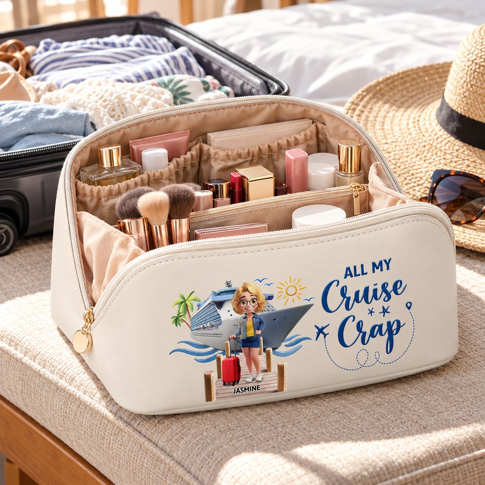 Open personalized cruise makeup bag packed with cosmetics beside a travel suitcase