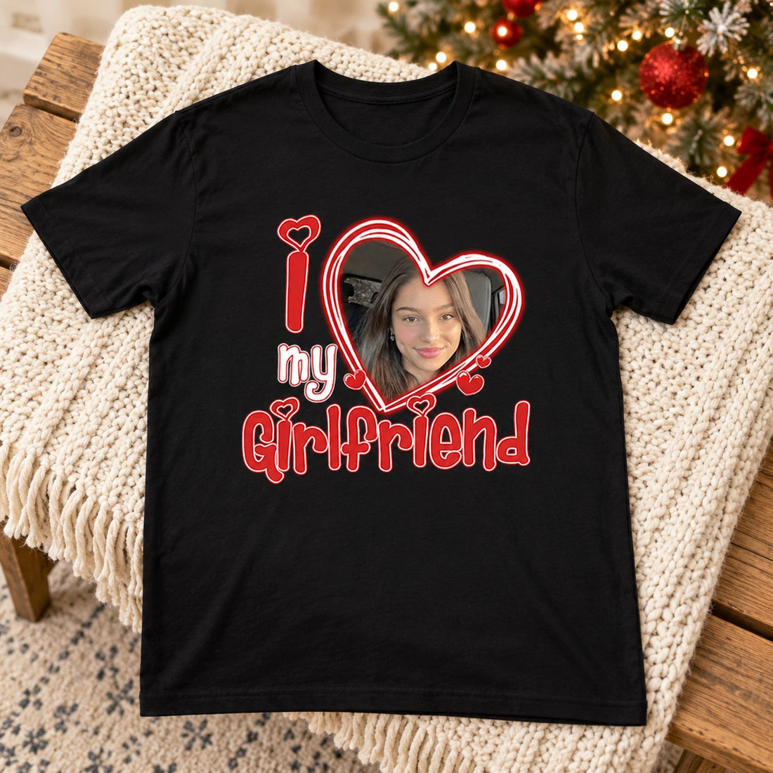 Custom Photo I Love My Girlfriend black t-shirt laid flat on knit throw near holiday tree