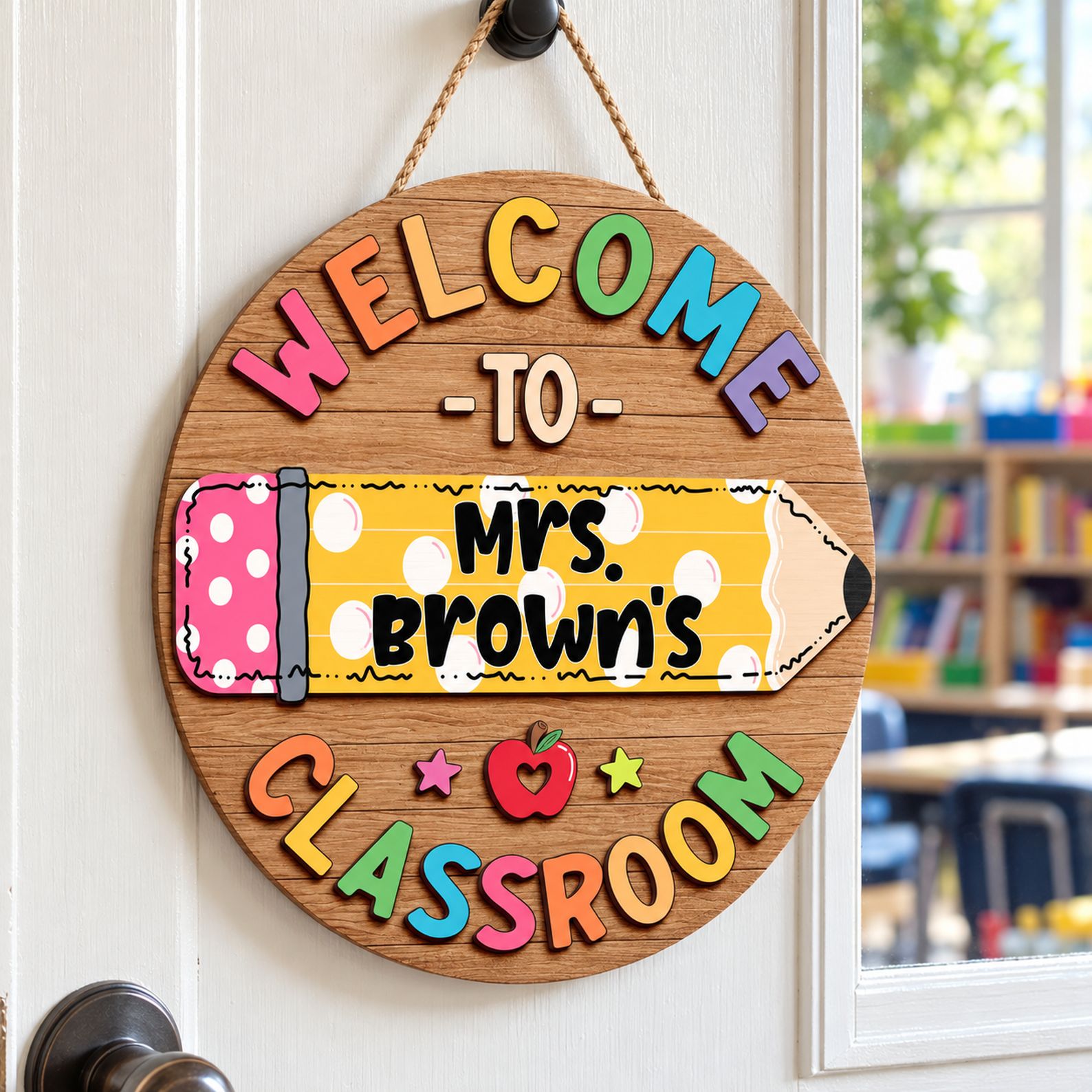 Personalized round wood teacher sign hanging on a bright classroom door for back to school