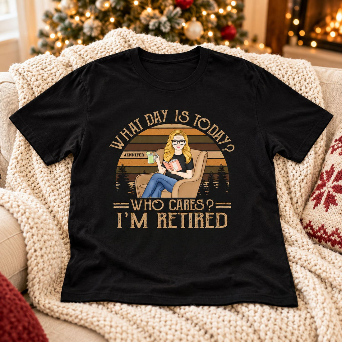 Personalized retirement reading t-shirt laid on a cozy sofa near a Christmas tree