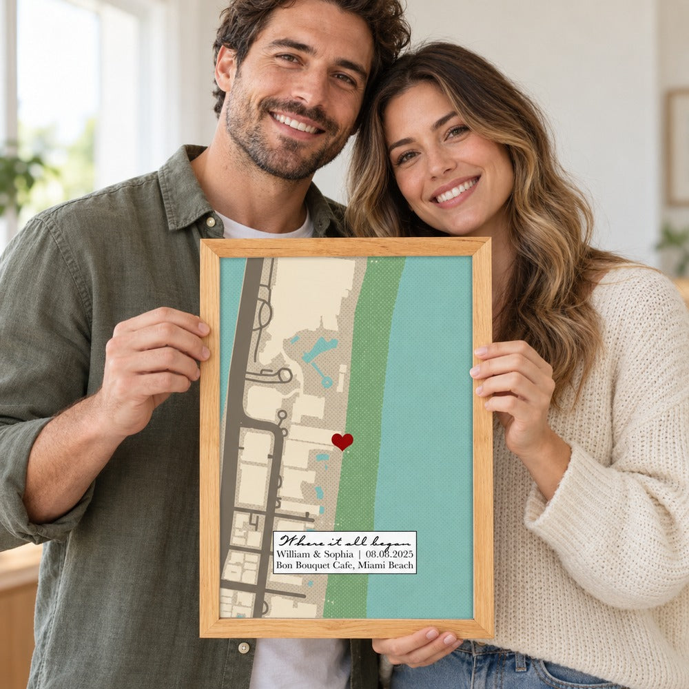 Happy couple holding their personalized Where It All Began map framed print