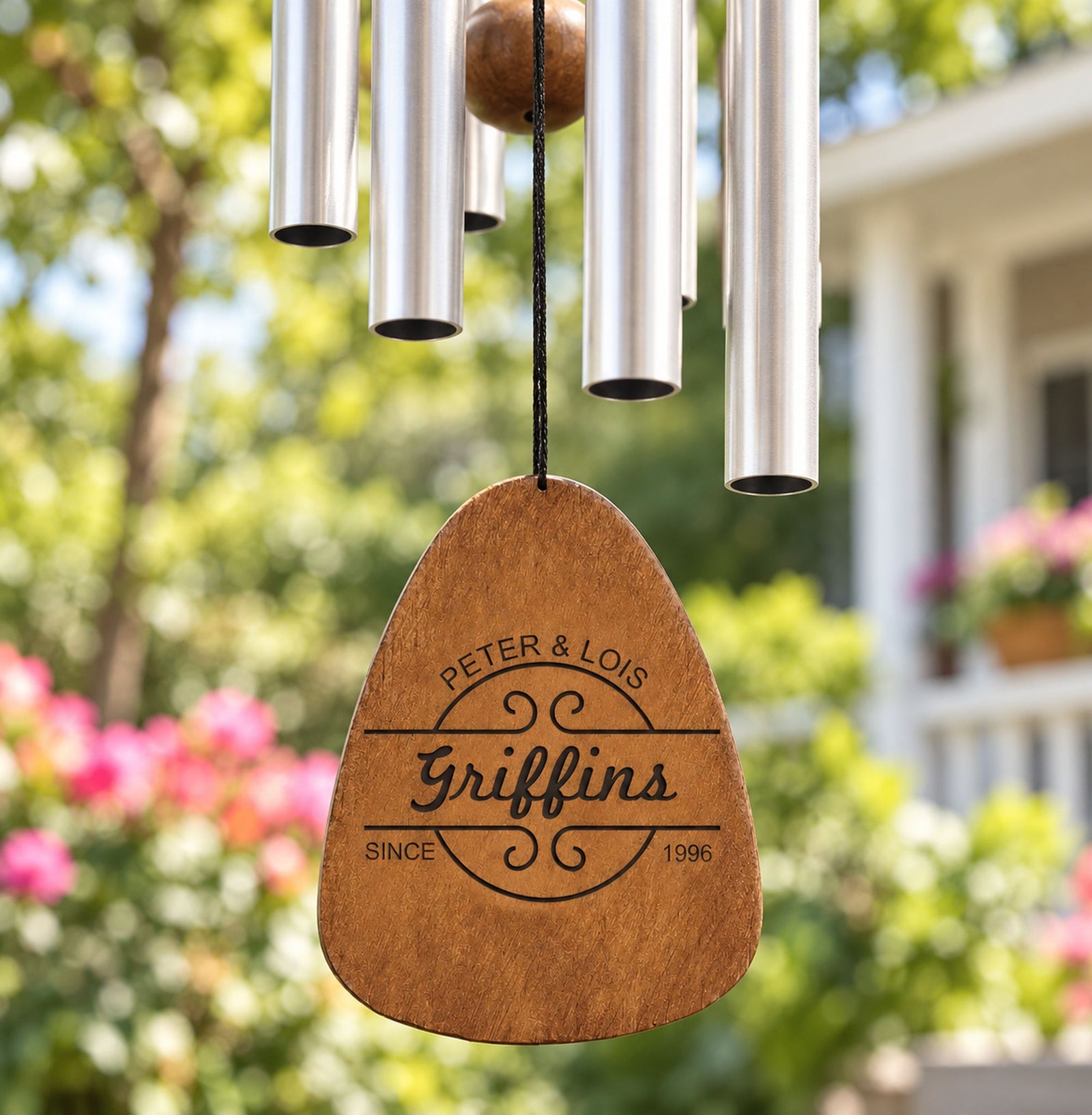 Close-up of laser engraved wooden pendant on custom anniversary wind chime