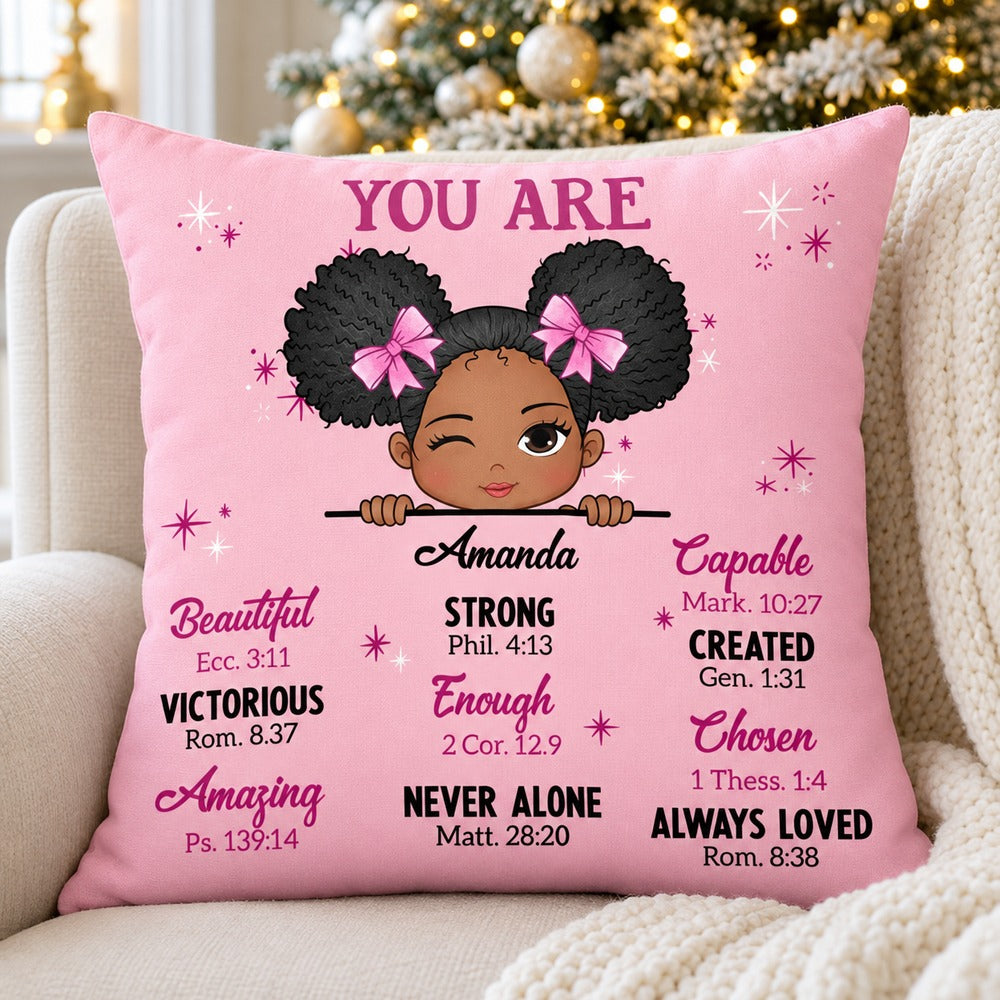 Personalized You Are Bible Verses pink throw pillow for Amanda on a cozy armchair by a Christmas tree