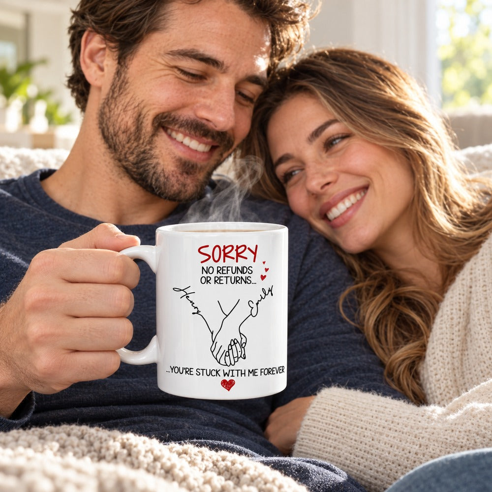 Couple holding personalized You Are Stuck With Me Forever ceramic mug on sofa