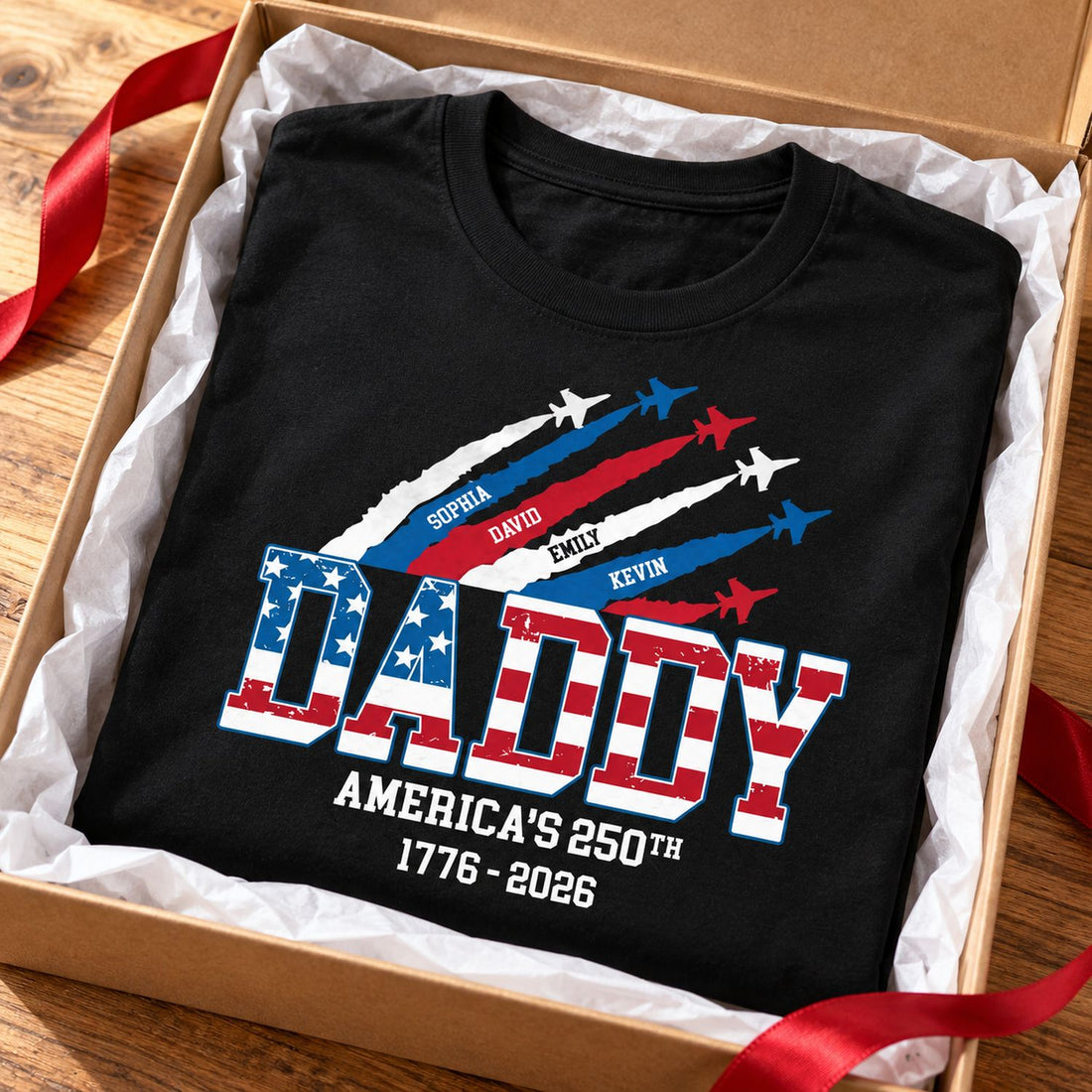 Personalized Daddy America 250th t-shirt folded in an open holiday gift box with ribbon