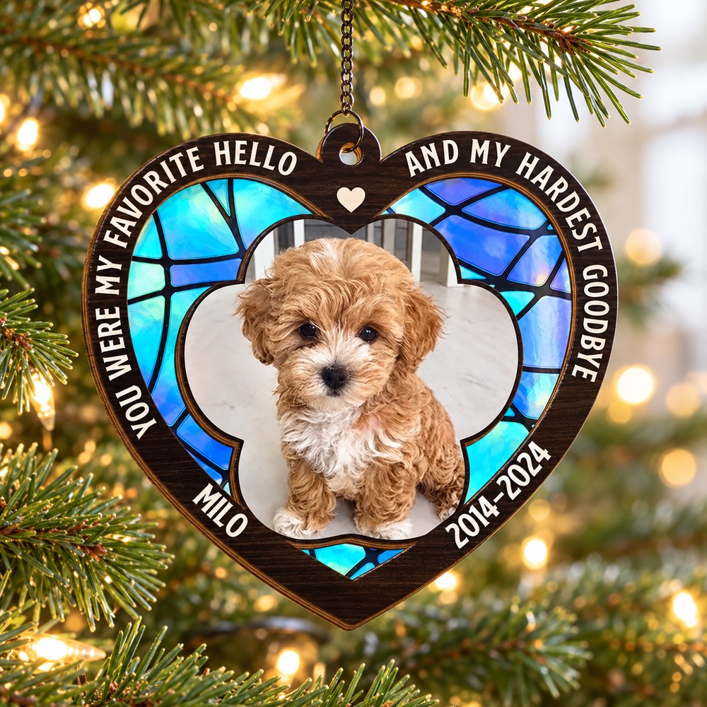 Custom dog photo sympathy suncatcher ornament hanging on a Christmas tree branch